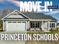 Charming move-in ready home with a two-car garage and well-manicured lawn in Princeton Schools at 144 Emerson Fields Dr, Pikeville, NC 27863