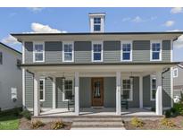 Charming two-story home with a welcoming front porch and beautiful architectural details at 210 Colvard Farms Rd, Durham, NC 27713