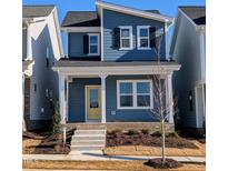 Two-story house with blue siding, yellow door, and a front porch at 908 Allen Park Dr, Raleigh, NC 27604