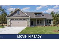 Charming one-story home featuring a two-car garage and well-manicured lawn at 609 Tuscany Cir, Princeton, NC 27569