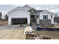 Craftsman-style home with stone accents and a two-car garage at 472 Barbour Farm Ln, Four Oaks, NC 27524