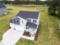 Beautiful two-story home with a two-car garage and adjacent golf course at 576 Barbour Farm Ln, Four Oaks, NC 27524