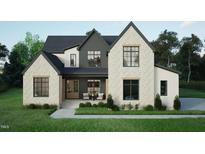 Charming two-story home with a brick facade and modern black frame windows at 3612 Bailey Meadows Drive Dr, Wake Forest, NC 27587