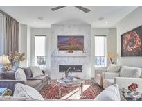 Spacious living room features a fireplace and large windows at 1100 Manor Way, Durham, NC 27701