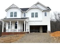 Two-story white house with a gray roof and brick foundation at 98 Claude Creek Dr, Smithfield, NC 27577