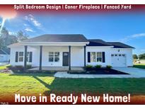 Move-in ready new home with split bedroom design, corner fireplace, and fenced yard at 36 Kevior Ave, Four Oaks, NC 27524