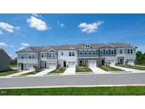 Beautiful townhome exteriors feature varied colors, landscaping, garages, and inviting curb appeal at 289 Hank Way, Angier, NC 27501