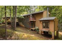 Multi-level home nestled in woods with deck at 4416 Arrowhead Trl, Hillsborough, NC 27278