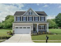 Two-story house with gray siding, white trim, and a two-car garage at 521 Impala Trce, Wendell, NC 27591