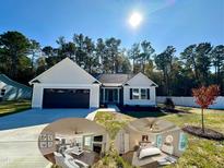 Charming single-story home with white siding, black garage door, and manicured front lawn at 207 Earnest Way # 15, Kenly, NC 27542