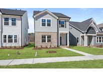 Charming two-story home with a landscaped yard and covered front entrance at 733 Portland Rose Dr, Knightdale, NC 27545