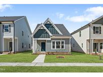 Charming home with a manicured lawn and a welcoming exterior at 737 Portland Rose Dr, Knightdale, NC 27545