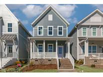 Charming two-story home with a welcoming front porch and well-manicured lawn, perfect for families at 1660 Piney Falls Dr, Wendell, NC 27591