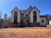 Stunning new home with a modern design and a combination of brick and siding at 65 Cherry Bark Dr, Youngsville, NC 27596