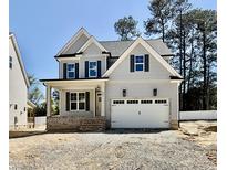 Charming two-story home with a covered front porch and a two-car garage at 2621 Silver Gate Ct, Wake Forest, NC 27587