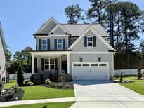 Charming two-story home with a well-manicured lawn and a classic American design at 2621 Silver Gate Ct, Wake Forest, NC 27587