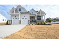 Beautiful new construction home with two-car garage and freshly landscaped yard at 89 S Bream Ct, Angier, NC 27501