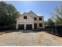 New construction home featuring a spacious two-story design with an attached two car garage at 208 E Whitaker Mill Rd, Raleigh, NC 27608