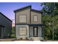 Modern two-story home with sleek lines, contrasting siding, and a welcoming front porch at 2337 E Main St, Durham, NC 27703