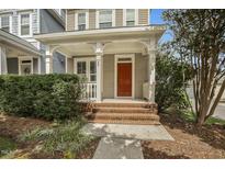 Inviting front porch and brick walkway leading to charming two-story home at 49 Danbury Ct, Pittsboro, NC 27312