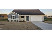Charming single-story home featuring a two-car garage, manicured lawn, and welcoming blue front door at 508 John Stark Dr, Fuquay Varina, NC 27526