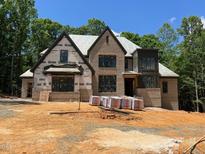 View of a brick home under construction with visible framing and building materials at 67 Ridgeline Ct # 7, Pittsboro, NC 27312