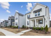 New construction homes with inviting front porches and landscaping at 1429 Patchings Ln, Knightdale, NC 27545