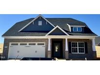 Two-story craftsman style home with gray siding, white trim, and a two-car garage at 1056 Fairhaven Dr # 97, Mebane, NC 27302
