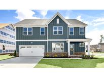 Beautiful two-story home with a well-maintained lawn and classic architectural details at 500 Lemon Daisy Ln, Knightdale, NC 27545