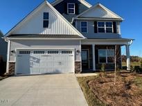 Charming two-story home with a two car garage and inviting front porch at 1911 Darrell Dr # 4, Graham, NC 27253