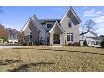 Charming two-story home with gray brick, stylish gables, and a welcoming front entrance at 701 Dartmouth Rd, Raleigh, NC 27609