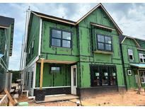 Two-story home under construction featuring black-framed windows and durable ZIP System sheathing at 2408 Adrift Road, Fuquay Varina, NC 27526