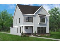 Two-story house with gray siding, black windows, and landscaping at 2408 Adrift Road, Fuquay Varina, NC 27526