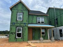 This is a two-story home under construction with visible ZIP System sheathing and white windows at 2412 Adrift Road, Fuquay Varina, NC 27526