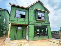 A two-story residence showcases the ZIP system sheathing, highlighting a modern and energy-efficient building approach at 2400 Adrift Rd, Fuquay Varina, NC 27526