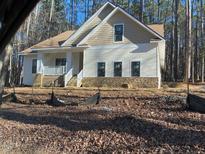 Craftsman style home with stone accents and a covered porch at 6021 Inverness Cir, Sanford, NC 27332