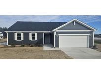 Charming single Gathering home featuring a two car garage, white trim, and dark siding at 566 John Stark Dr, Fuquay Varina, NC 27526