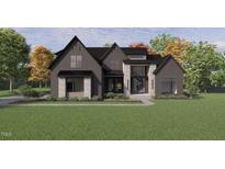 Stunning new construction home featuring a modern design with black brick and stone accents, plus professional landscaping at 504 Colvard Woods Way Way, Durham, NC 27713