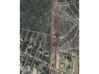 Aerial view showing a large lot with surrounding trees and neighboring properties at 3028 Mt Vernon Church Rd, Raleigh, NC 27613