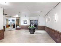 Elegant building lobby with tile floors, modern lighting, and stylish decor creating an inviting entrance at 222 Glenwood Ave # 508, Raleigh, NC 27603