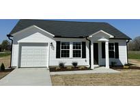Charming single-story home featuring a white facade, black shutters, and a well-manicured lawn at 111 Johnson Ridge Way, Four Oaks, NC 27524