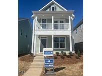 Charming two-story home with inviting front porch and manicured front yard at 707 Georgia'S Landing Pkwy # 105, Raleigh, NC 27603