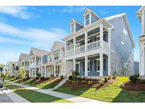Charming new construction homes line a pristine street with inviting, covered front porches at 9216 Leaning Post Rd # 447, Wake Forest, NC 27587