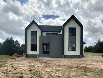 Striking new construction home with black framed windows and a modern color scheme at 280 Forest Bridge Rd, Franklinton, NC 27525