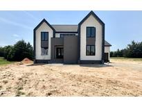 Striking two-story home featuring modern architectural design and a beautifully landscaped yard at 280 Forest Bridge Rd, Franklinton, NC 27525