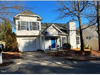 Two-story house with white siding, blue door, and attached garage at 1107 Mallory Ln # 91, Durham, NC 27713