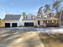 Two-story house with attached garage and large driveway at 12905 Barsanlaw Dr, Raleigh, NC 27613