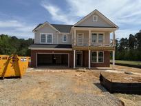 Under construction two story home featuring a brick foundation and unfinished porch at 34 Macy Cir, Wendell, NC 27591