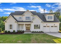 Beautiful two-story home with a well-manicured lawn and attached two car garage at 27 Asti Ct, Clayton, NC 27527