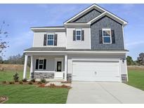 Charming two-story home featuring a two-car garage, inviting front porch, and modern siding design at 180 Deodora Ln, Cameron, NC 28326